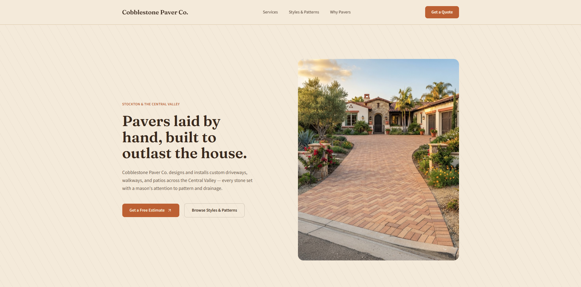 Cobblestone Paver Co. website homepage with a herringbone brick driveway hero photo and the headline pavers laid by hand, built to outlast the house